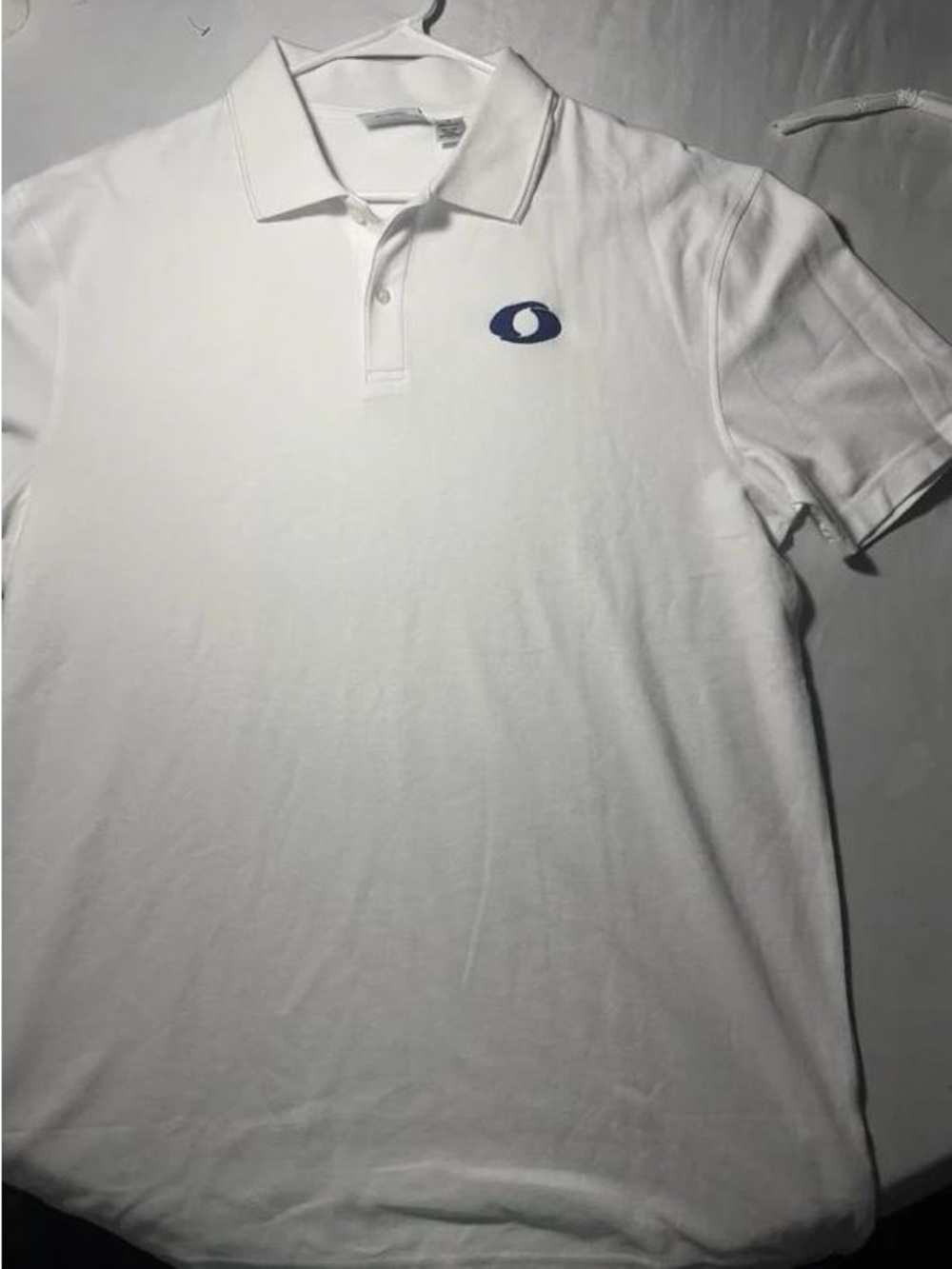 Classic White Short-Sleeve Polo with Blue Crest